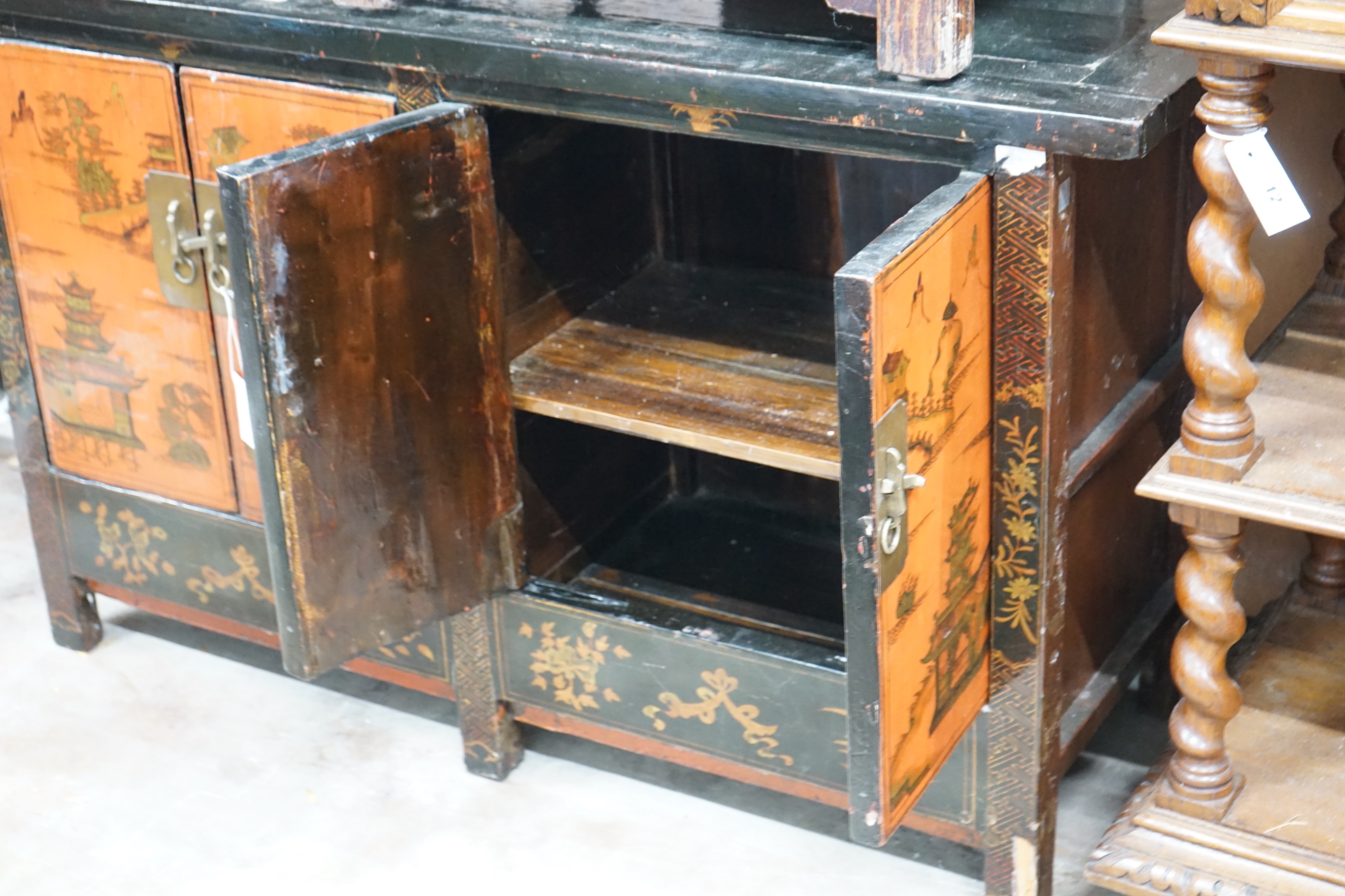 A Chinese lacquered low cabinet, width 112cm depth 41cm height 75cm